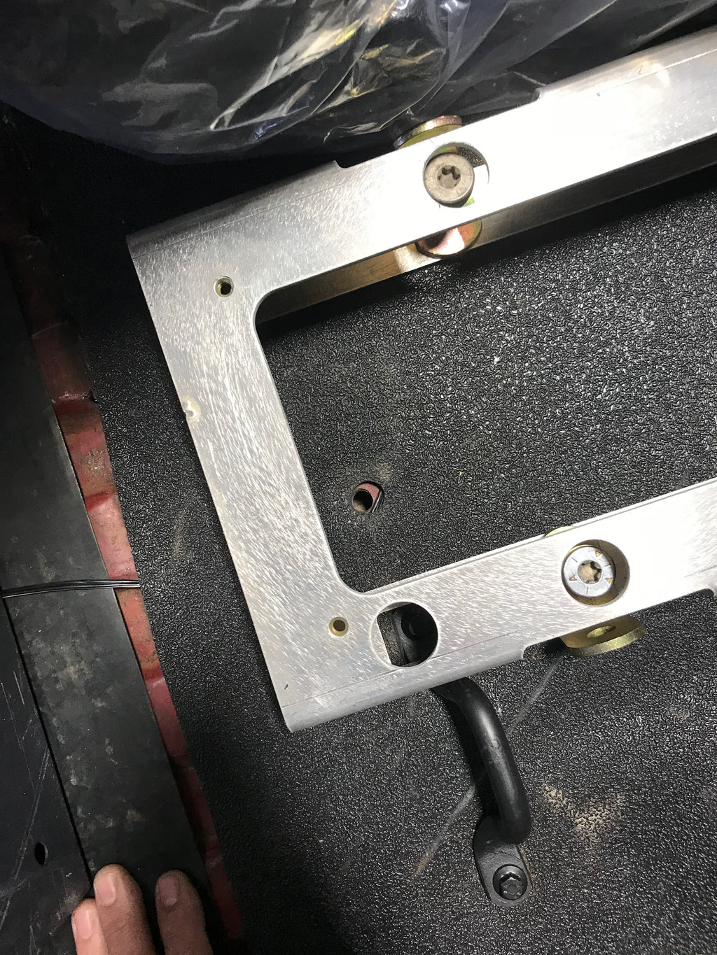 Center console with mounting floor bracket for Broncos