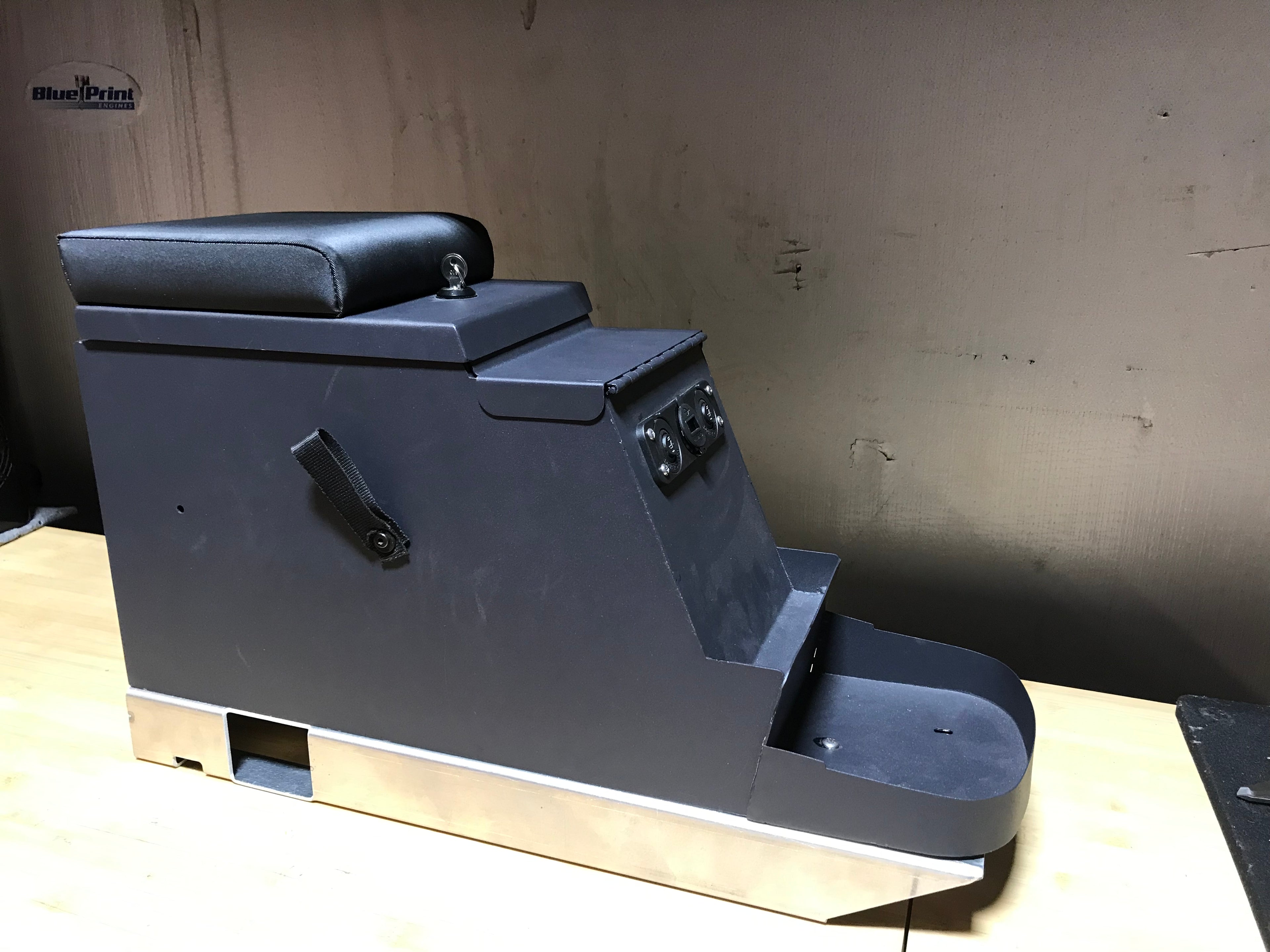 Center console with mounting floor bracket for Broncos