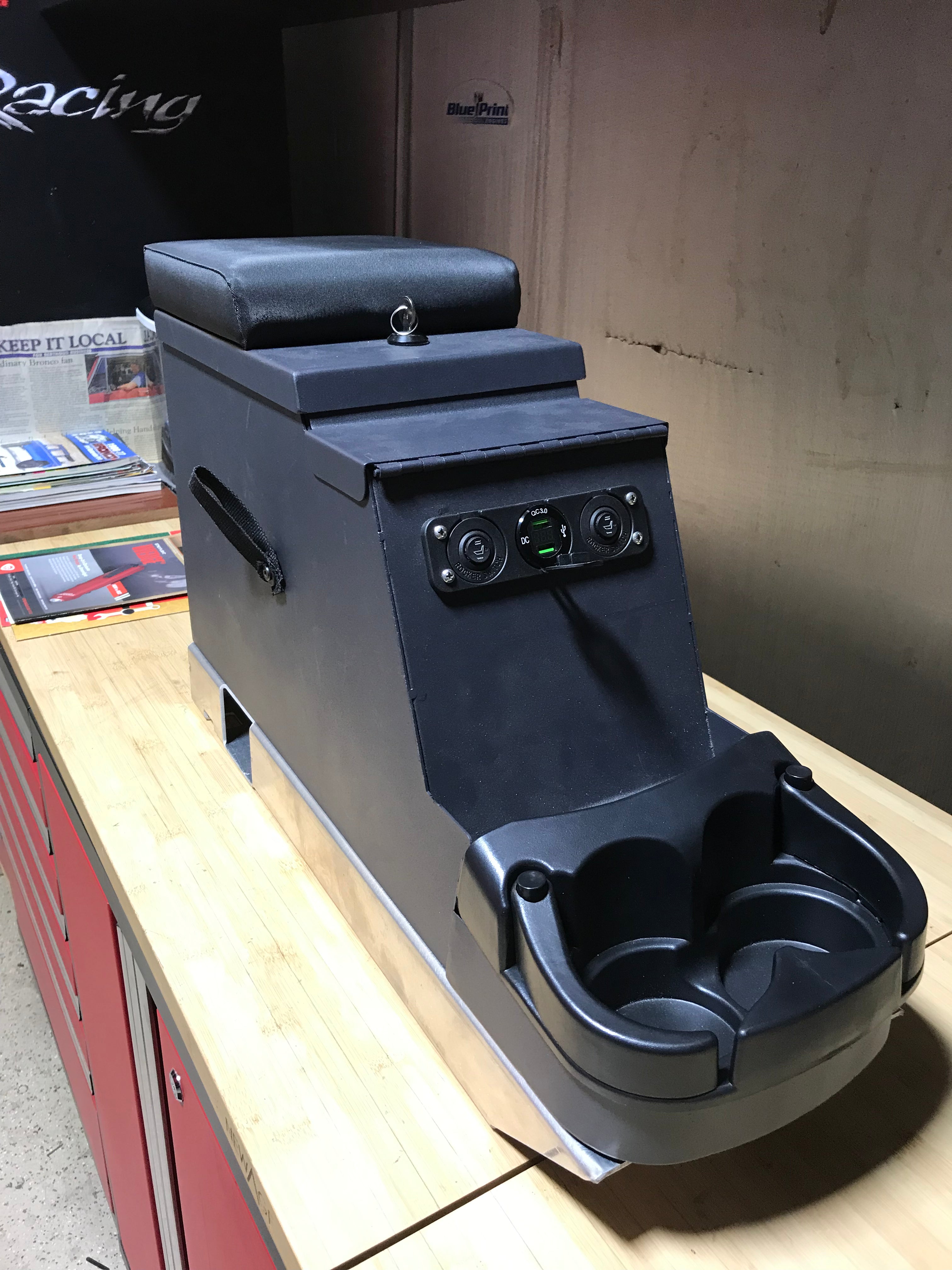 Center console with mounting floor bracket for Broncos